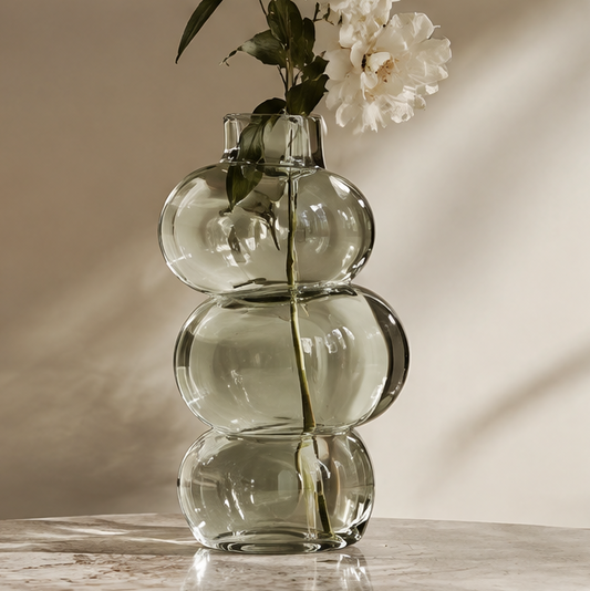 SPIRAVE smoky green triple-orb glass vase styled with white flowers, without text overlay