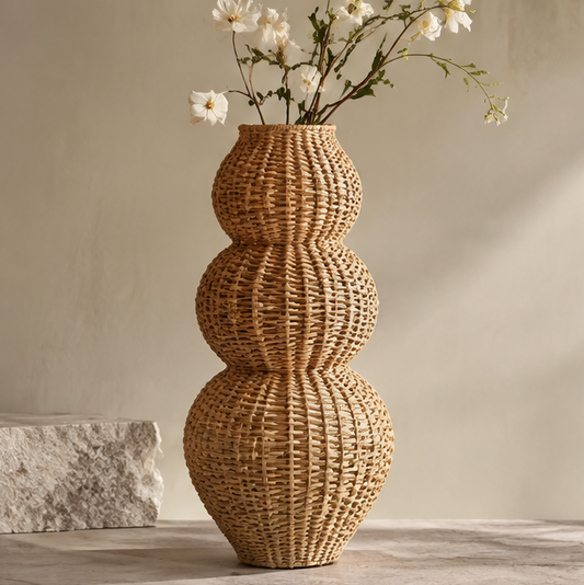 SPIRAVE triple-orb woven rattan vase styled with white flowers, without text overlay