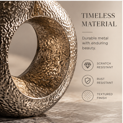 Close-up of the flared opening and irregular textured metal surface
